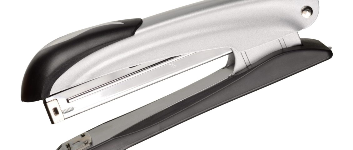 Grey office stapler isolated on white background with clipping path